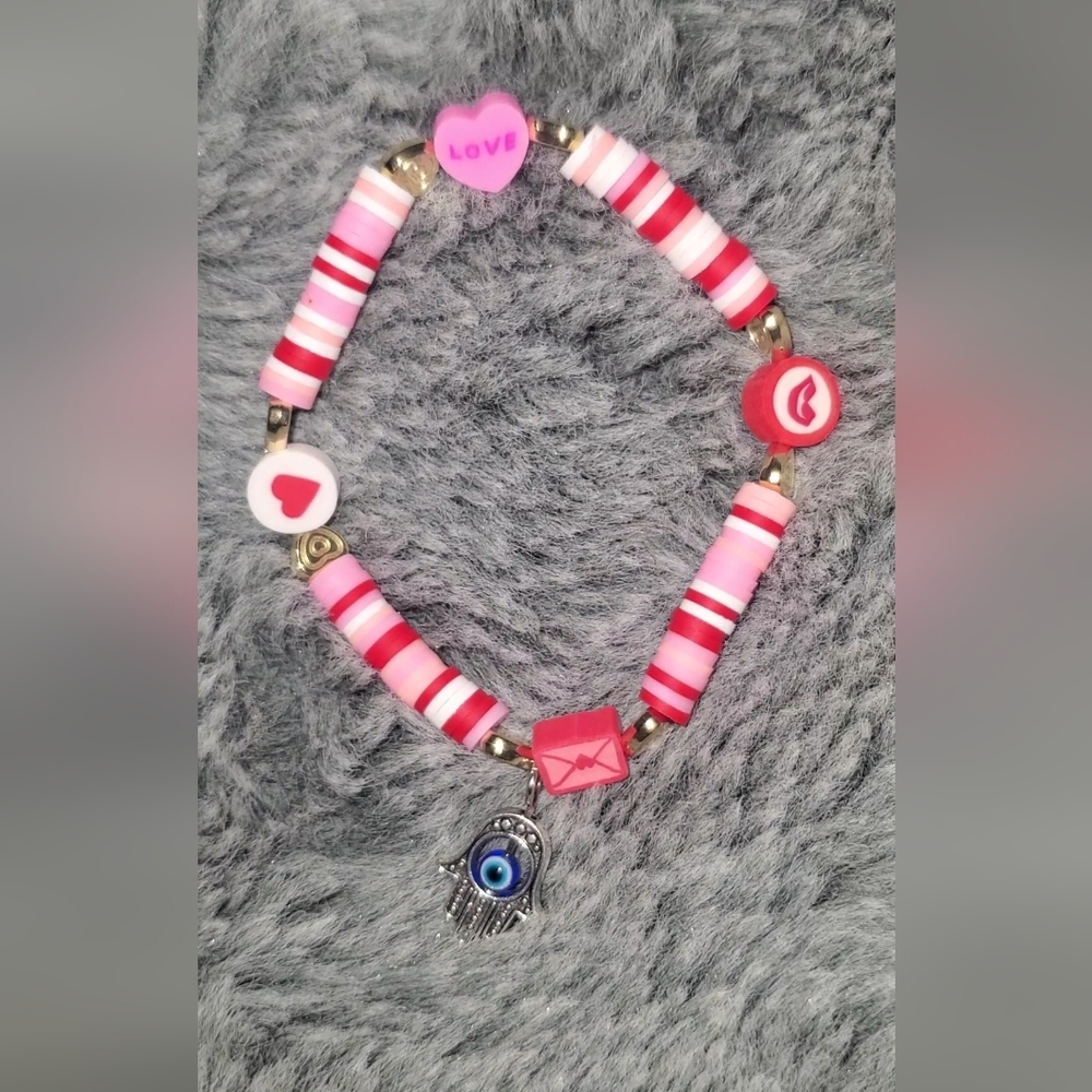 Pink and Red Beaded Bracelet with Evil Eye Charm